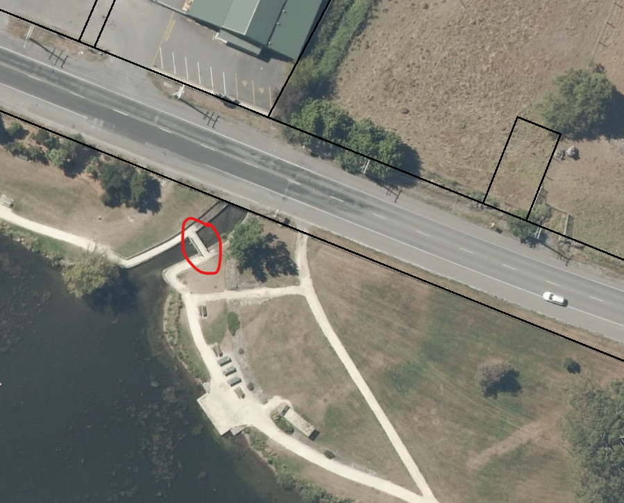 Aerial photo with red outline showing affected footbridge